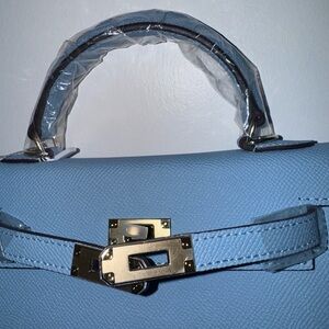 Chic Blue Satchel with Gold Clasp and Curved Handle